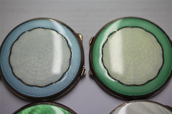 Two 1920s and two 1930s Art Deco engine turned silver and guilloche enamel circular compacts, 2.75in et infra.